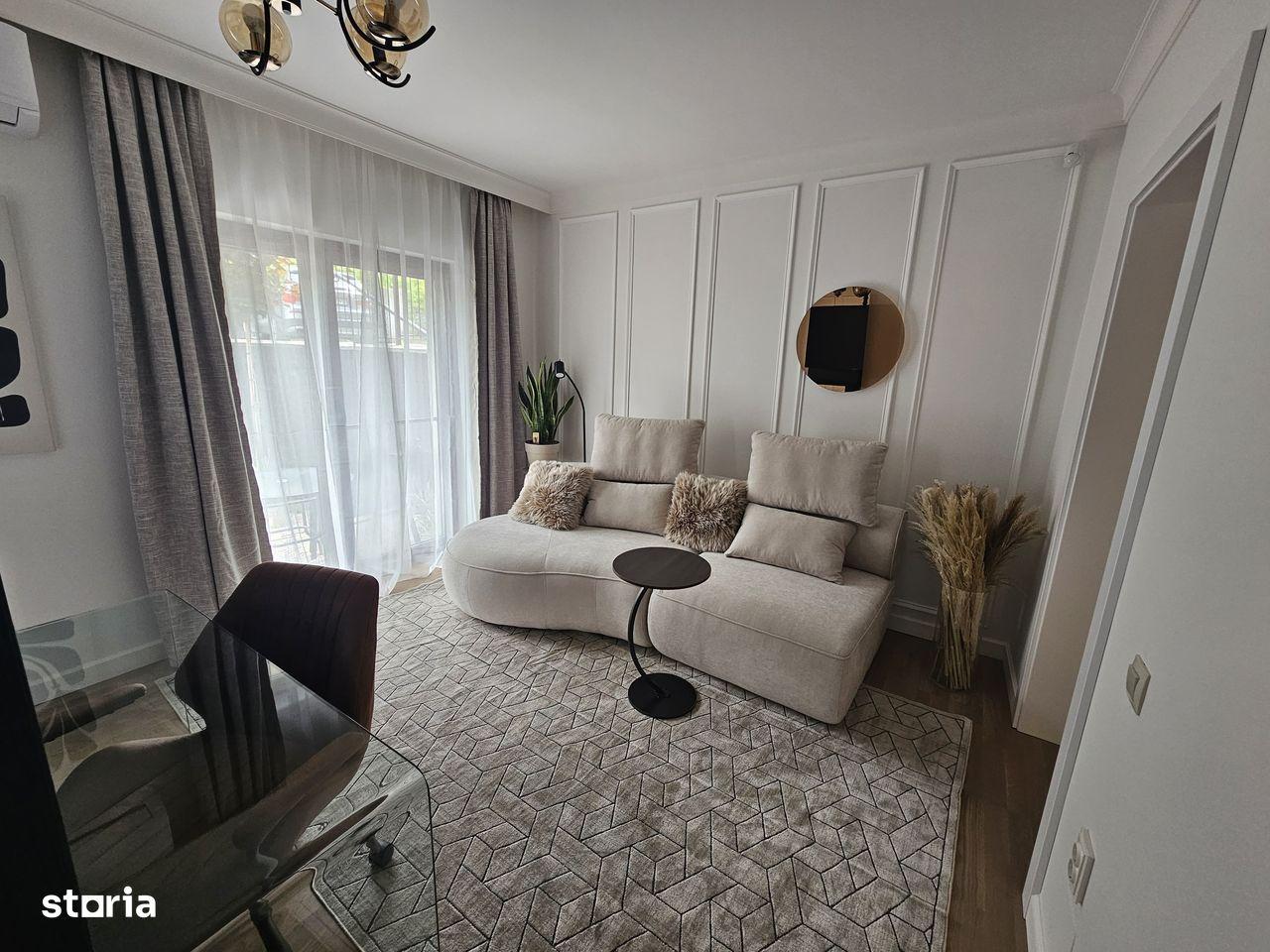 Apartament modern cu grădină superbă și parcare acoperită - imagine 1